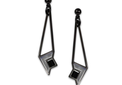 A pair of art glass earrings with a geometric design inspired by Frank Lloyd Wright's Susan Lawrence Dana House, featuring a black hematite finish.