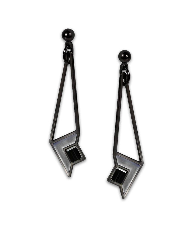 A pair of art glass earrings with a geometric design inspired by Frank Lloyd Wright's Susan Lawrence Dana House, featuring a black hematite finish.