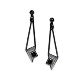 A pair of art glass earrings with a geometric design inspired by Frank Lloyd Wright's Susan Lawrence Dana House, featuring a black hematite finish.
