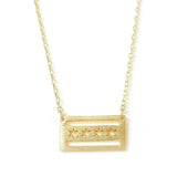 A gold-colored necklace featuring a pendant shaped like the Chicago flag with a brushed texture.