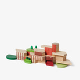 A set of multicolored wood architectural building blocks arranged in the style of Frank Lloyd Wright's Usonian homes.