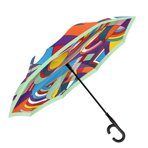 A colorful, geometric patterned umbrella inspired by Frank Lloyd Wright designs, with a reverse (inside-out) stick umbrella structure.