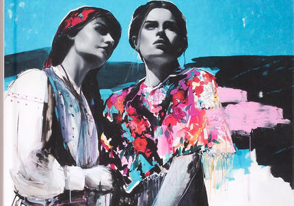 Book cover for 'Ukraine Rising: Contemporary Creative Culture from Ukraine' featuring two women with traditional attire against a blue background.