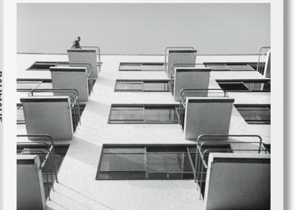 Cover of the book 'BAUHAUS' by Magdalena Droste, featuring a black and white photograph of a Bauhaus-style apartment building.