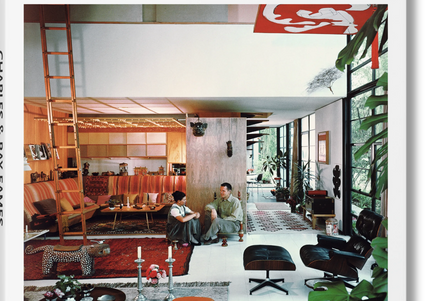 Cover of the 'Eames Taschen Basic Art' book, featuring a photograph of Charles and Ray Eames sitting in a home with various furniture pieces and decorative items.