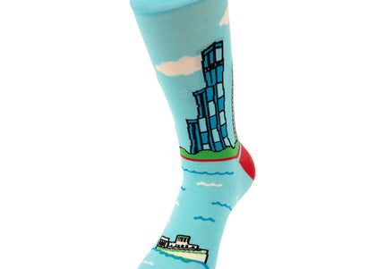 Light blue sock with a cityscape design