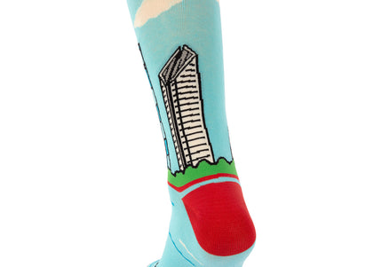Colorful sock with a building design on a light blue background