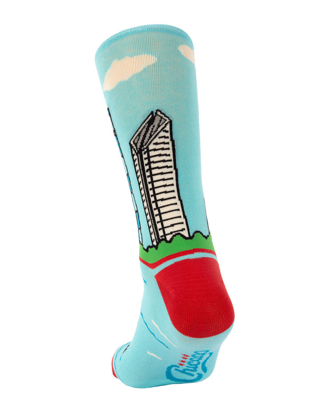 Colorful sock with a building design on a light blue background
