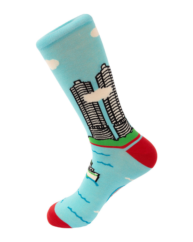 Colorful sock with cityscape design on a light blue background