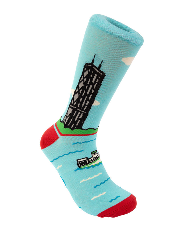 Sock with a design of a building and landscape on a light blue background