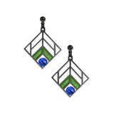 A pair of dangling earrings with a geometric chevron design in blue and green colors, with a hematite finish.