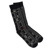 A pair of black socks featuring a design of a grey "L" train car.