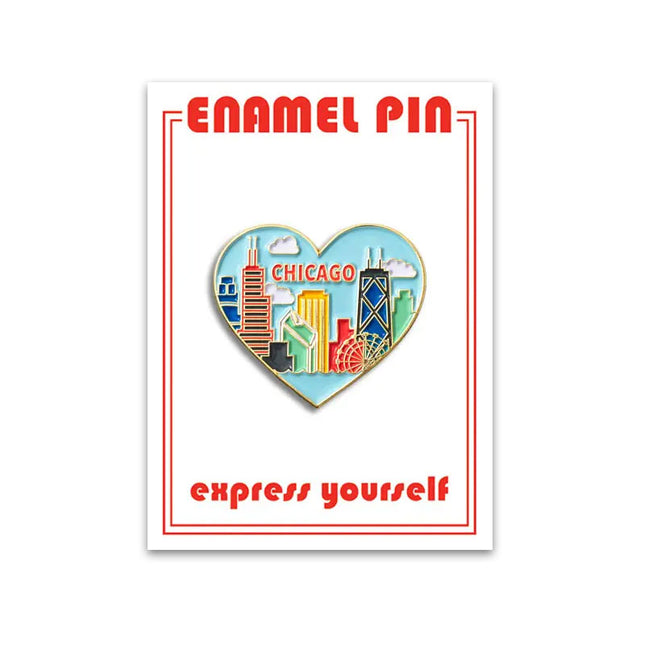 A heart-shaped enamel pin with a Chicago skyline design and the text 'Chicago'.