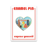 A heart-shaped enamel pin with a Chicago skyline design and the text 'Chicago'.