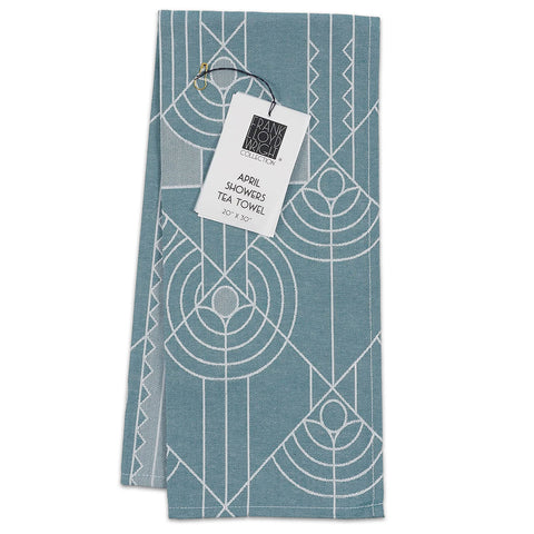 A blue and white geometric patterned tea towel with a Frank Lloyd Wright label.