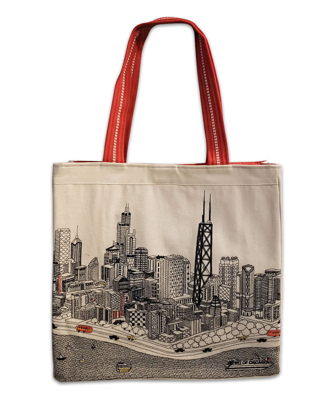 A tote bag with a white fabric featuring a detailed illustration of a city skyline and red ribbed straps.