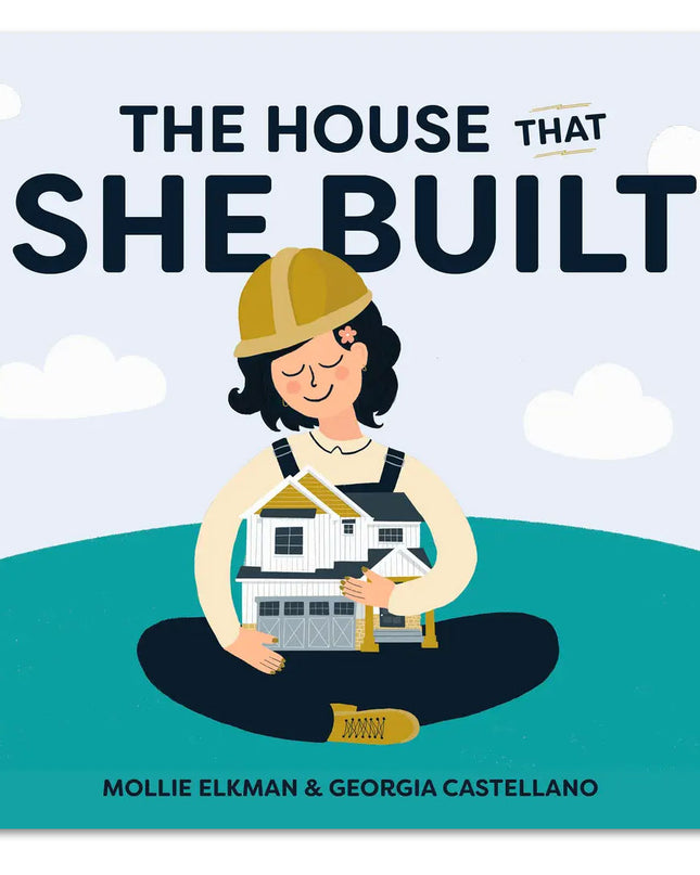 Cover of the children's book 'The House that She Built' featuring an illustration of a young girl in a hard hat construction hat, sitting and holding a house under construction.